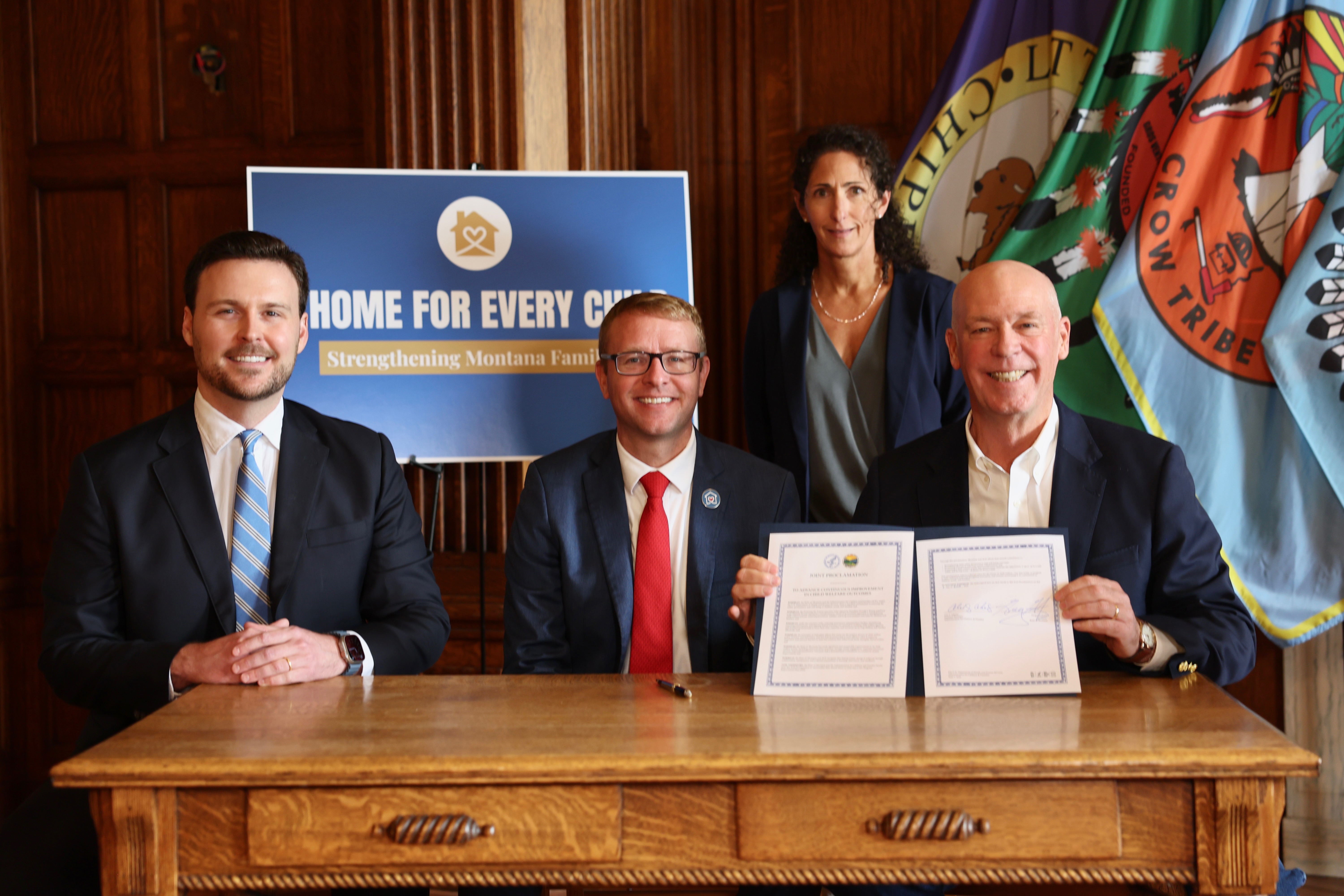 Gov. Gianforte, ACF Assistant Secretary Adams, Montana Child and Family Services Division Administrator Grossberg, and DPHHS Director Brereton, from right to left, signing a joint proclamation for A Home for Every Child 
