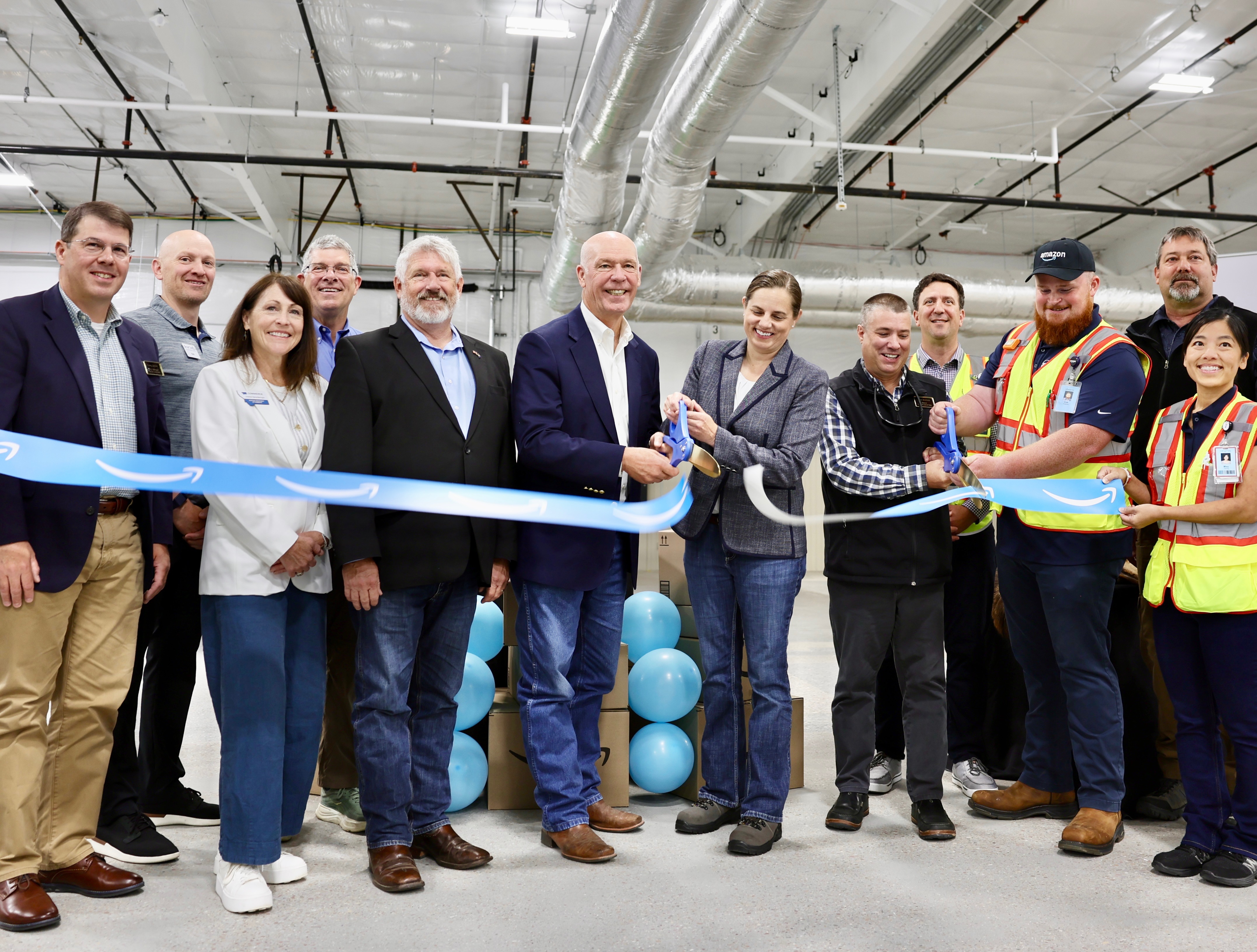 Gov. Gianforte helping cut the ribbon on the Amazon delivery station in Great Falls 