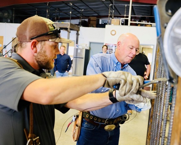 Gov. Gianforte with an apprentice at a facility in East Helena in July 2023