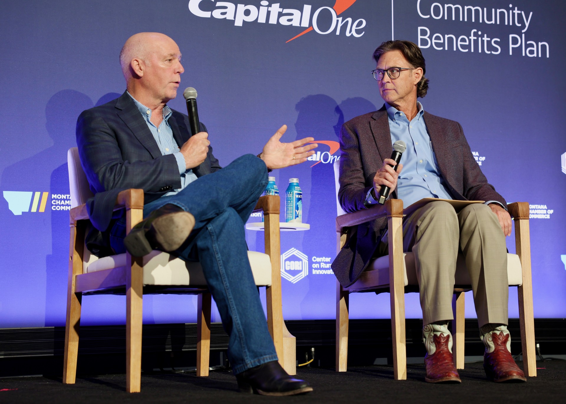 Gov. Gianforte (left) and Todd O’Hair (right), President and CEO of the Montana Chamber of Commerce, speaking during a Capital One event in Bozeman