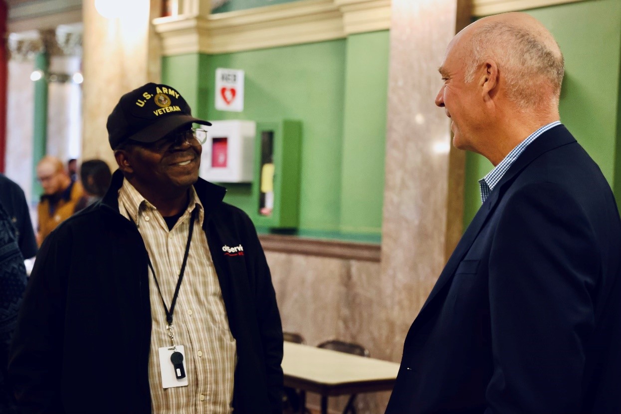 Governor Gianforte visiting with a veteran