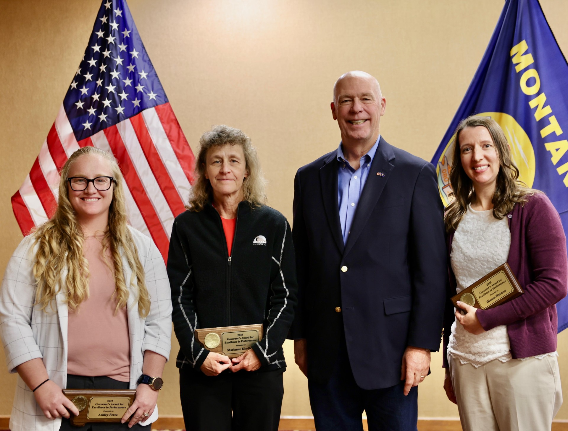 Gov. Gianforte presenting awards to the Montana State Auditor’s Office Insurance Division Rates Team