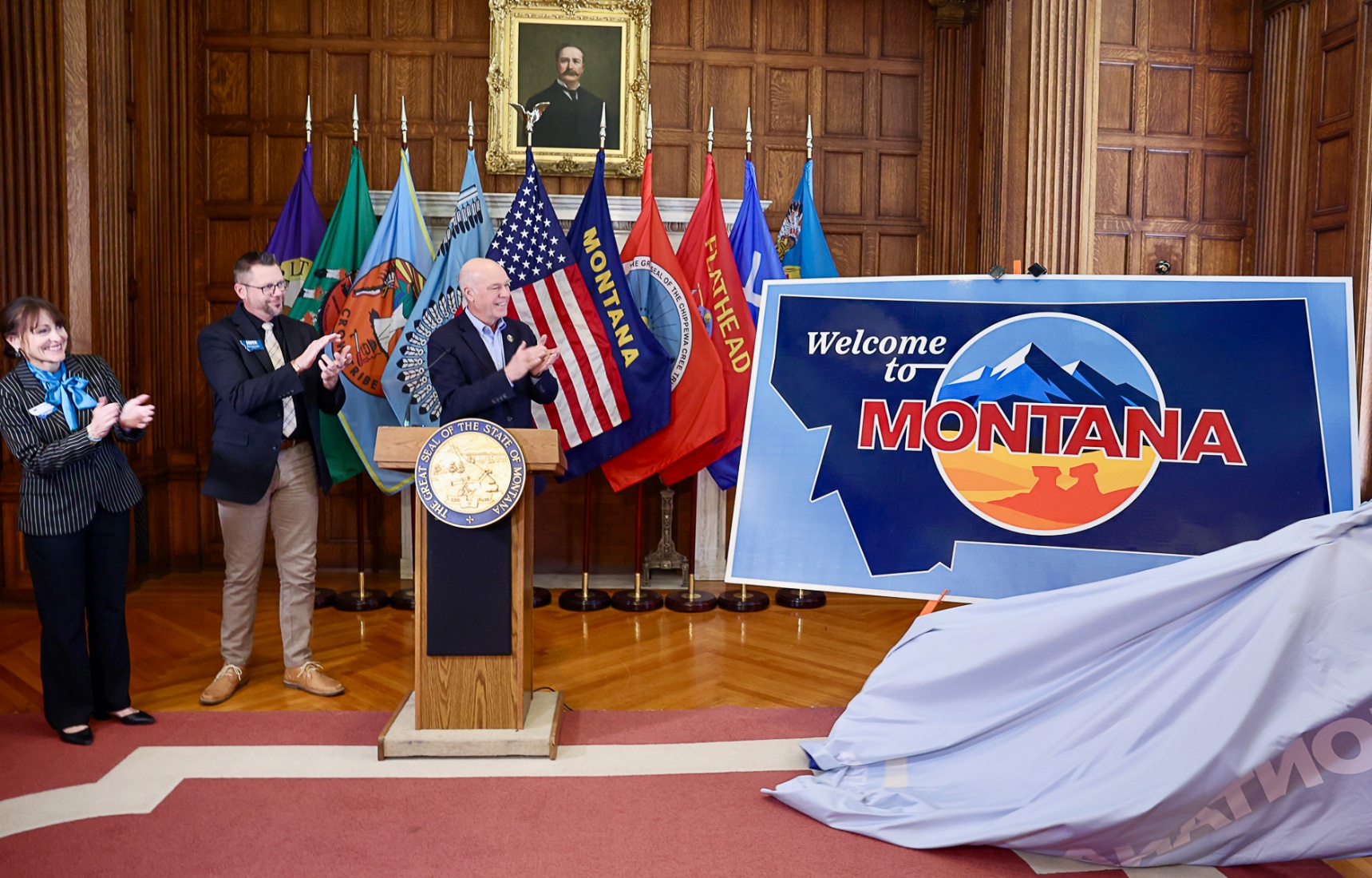 Gov. Gianforte (right), Dir. Dorrington (middle), and Dir. Bertoglio (left) unveiling Montana’s new highway welcome signs