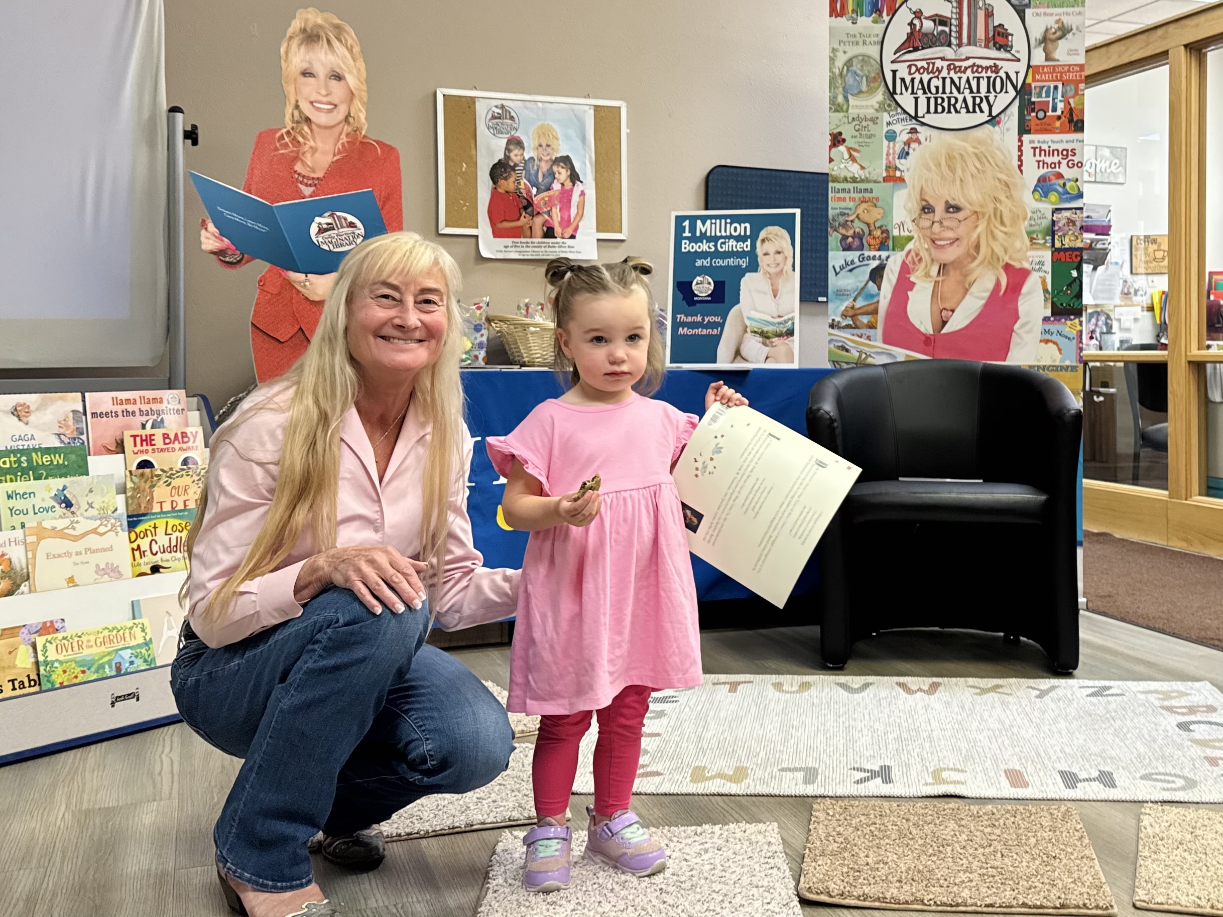 First Lady Susan Gianforte delivering the millionth book mailed through the Montana Imagination Library to a child in Butte