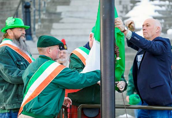 Gov. Gianforte raises the tricolor flag at the Montana State Capitol