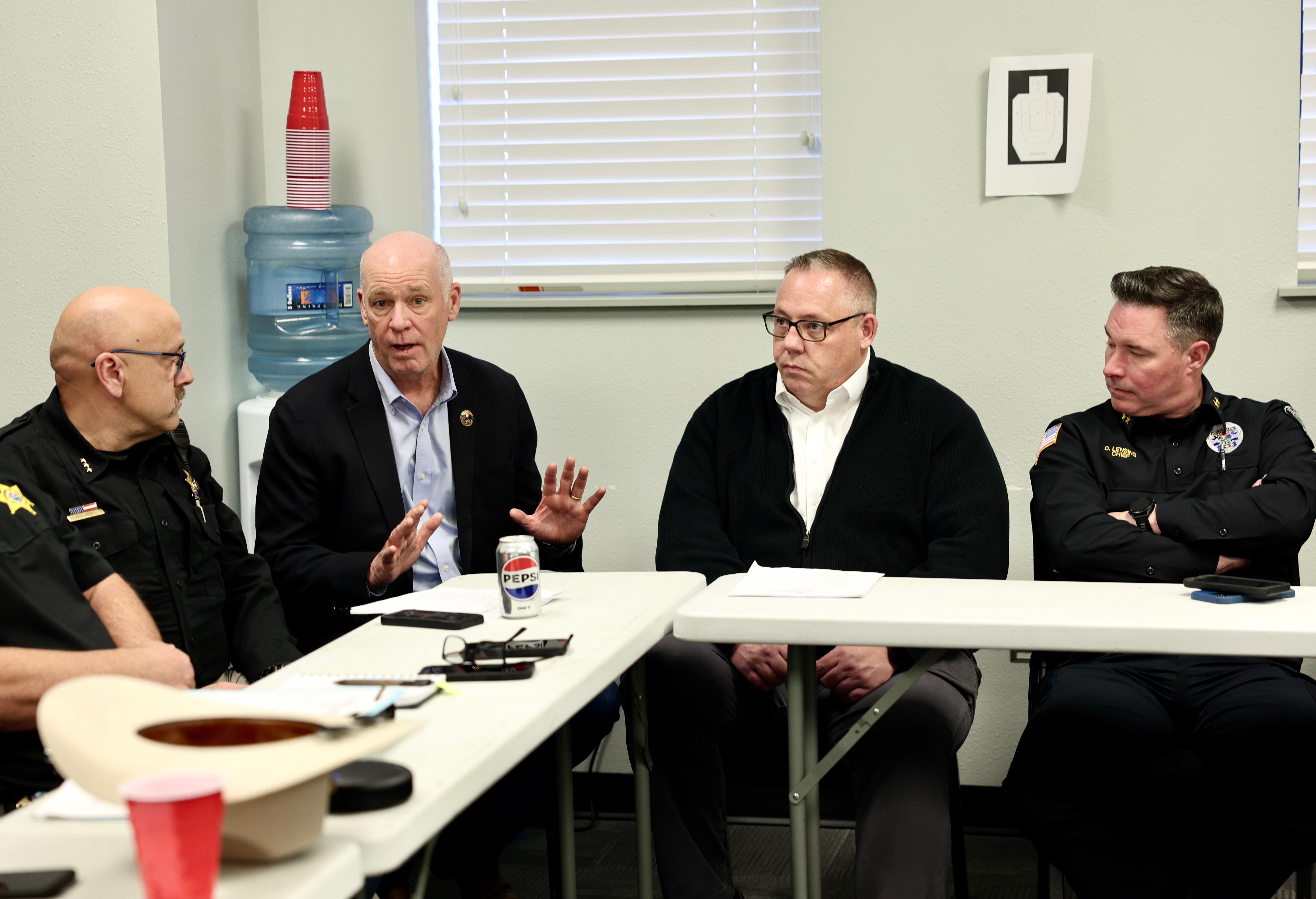 Gov. Gianforte meeting with law enforcement officers at a board meeting of the Missouri River Drug Task Force in Livingston