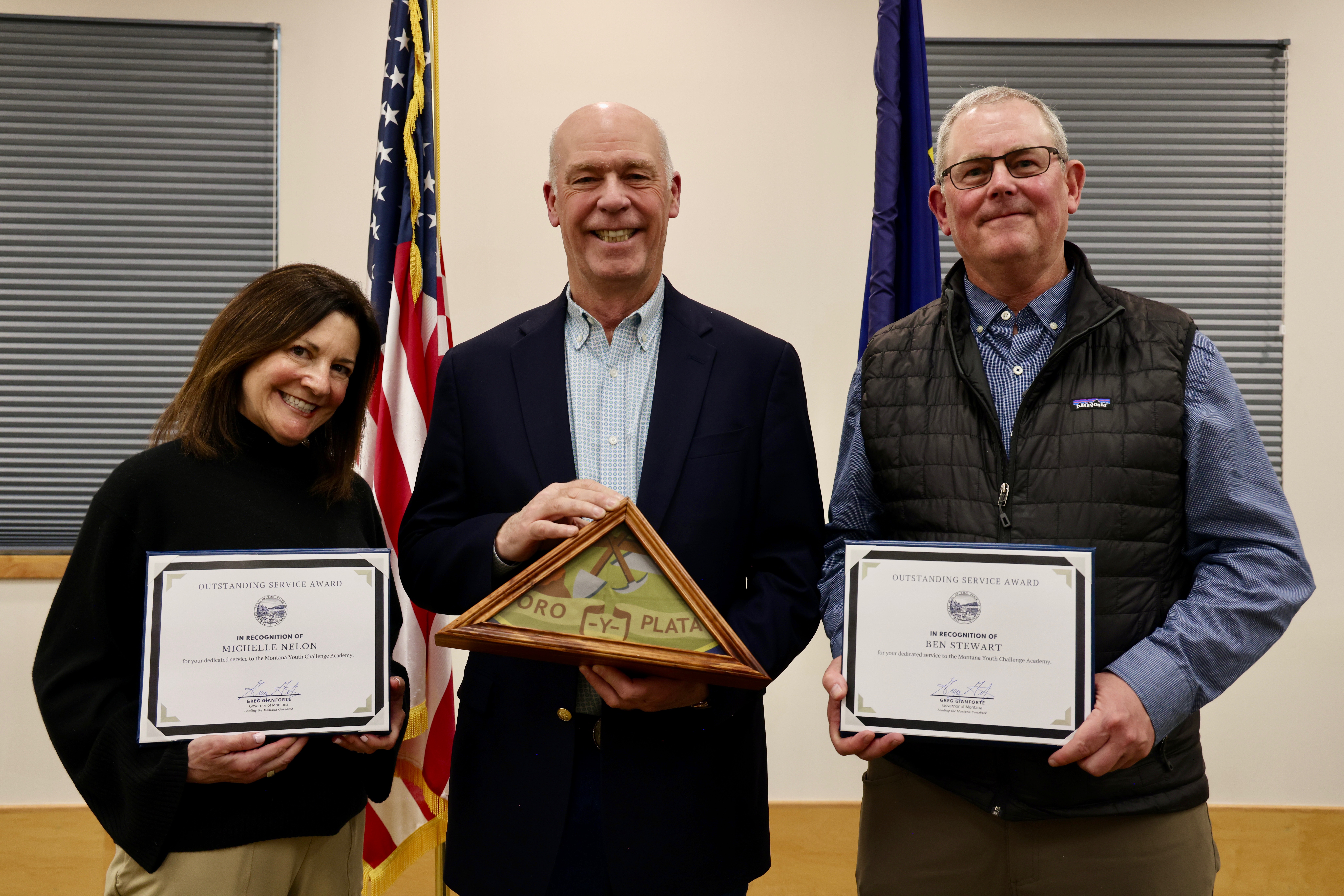 Gov. Gianforte recognizing OSA recipients, Michelle Nelon (left) and Ben Stewart (right), during a ceremony in Dillon