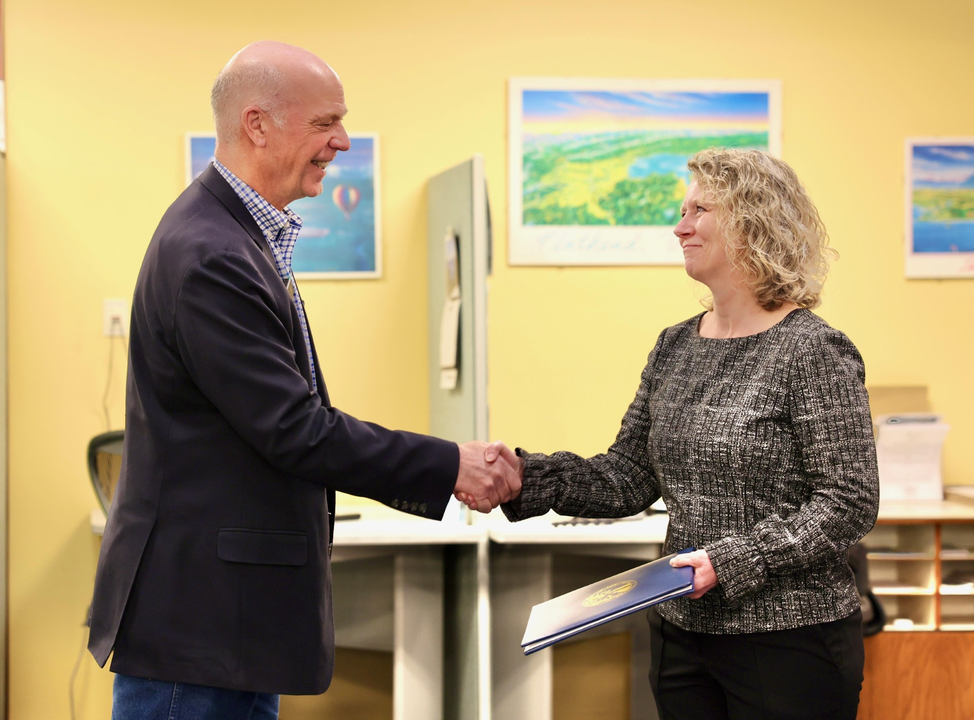 Gov. Gianforte honoring Laura Gardner at the DLI Job Service office in Kalispell