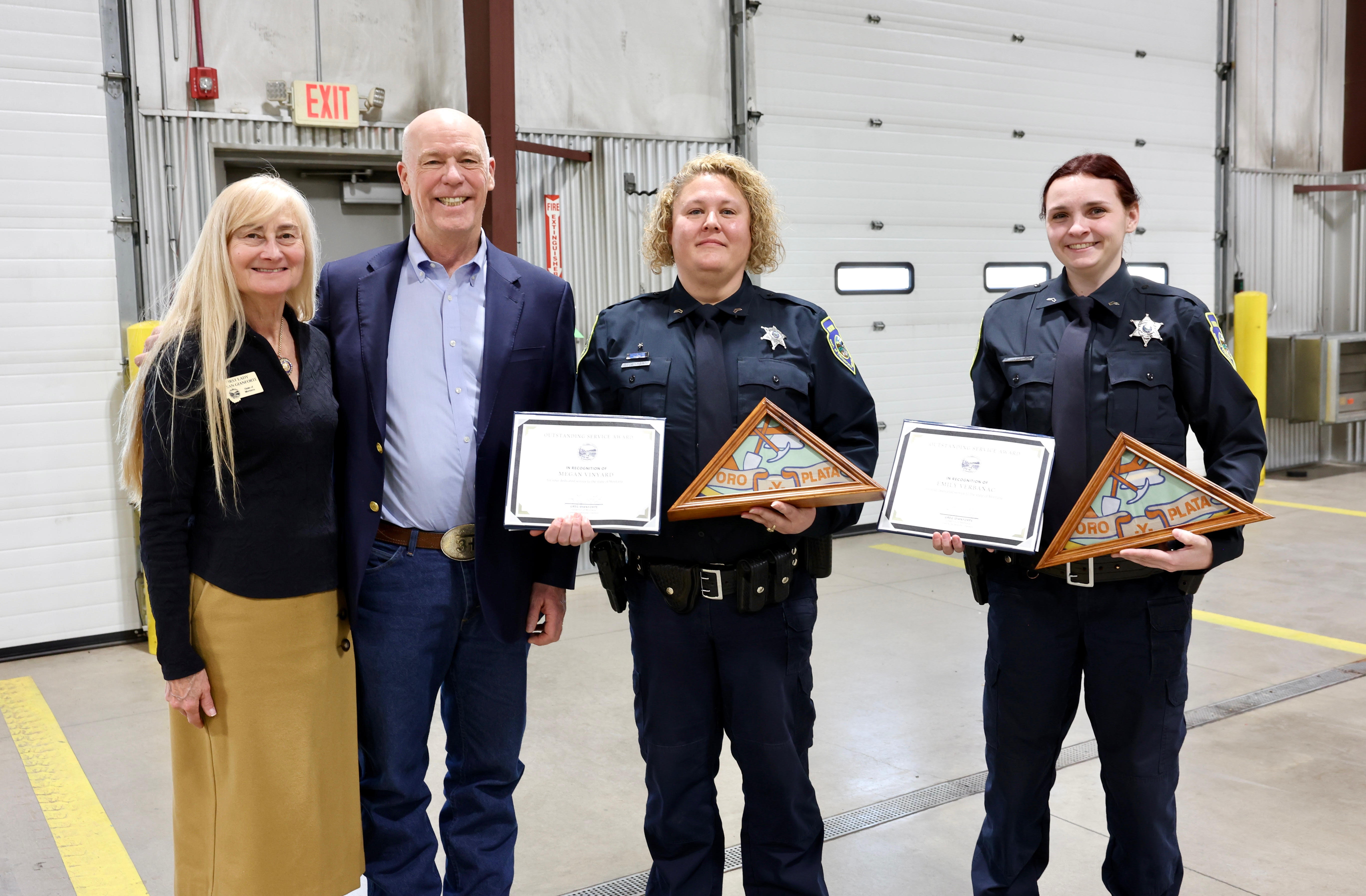 Gov. and First Lady Gianforte honoring MDT employees Corporal Verbanac (right) and Corporal Vinyard (middle) during a ceremony held in Missoula