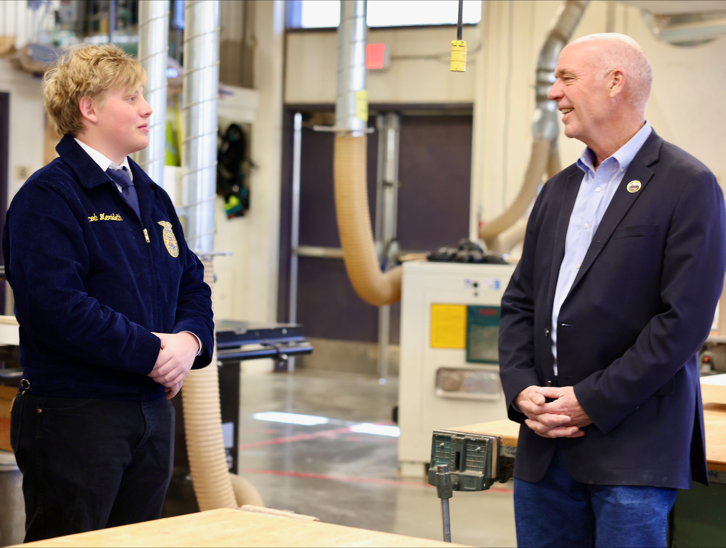Gov. Gianforte meeting with a Park High School student in woodshop class