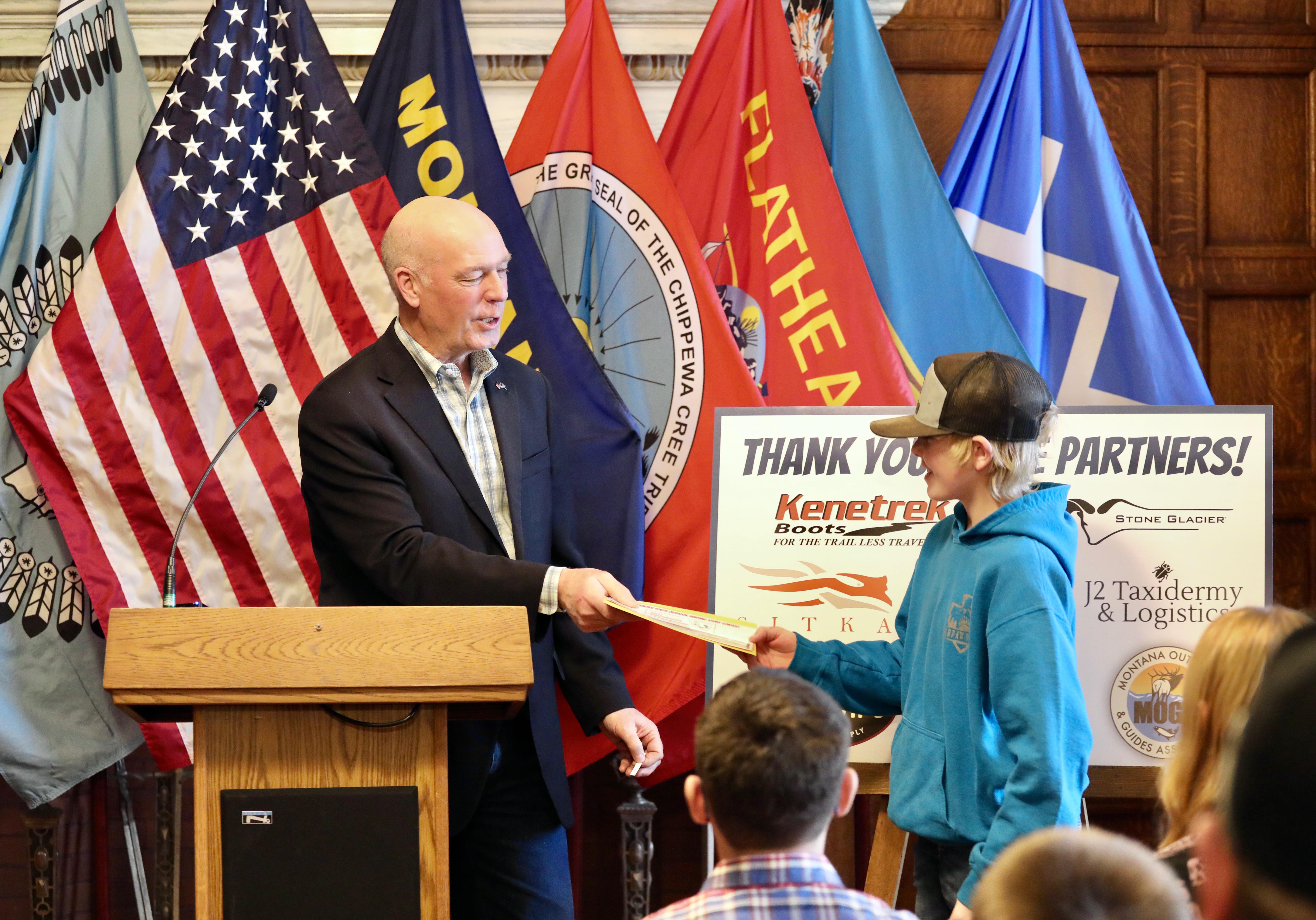 Gov. Gianforte recognizing Kael Milam of Havre as one of ten winners of the 2025 Youth Hunting Story Contest during a ceremony held at the State Capitol