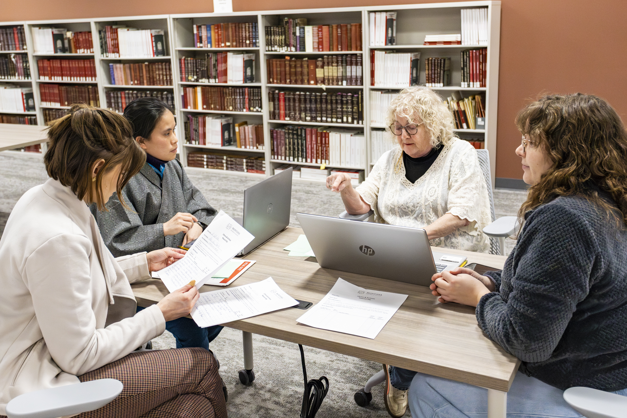 A group of researchers gathered around a table.