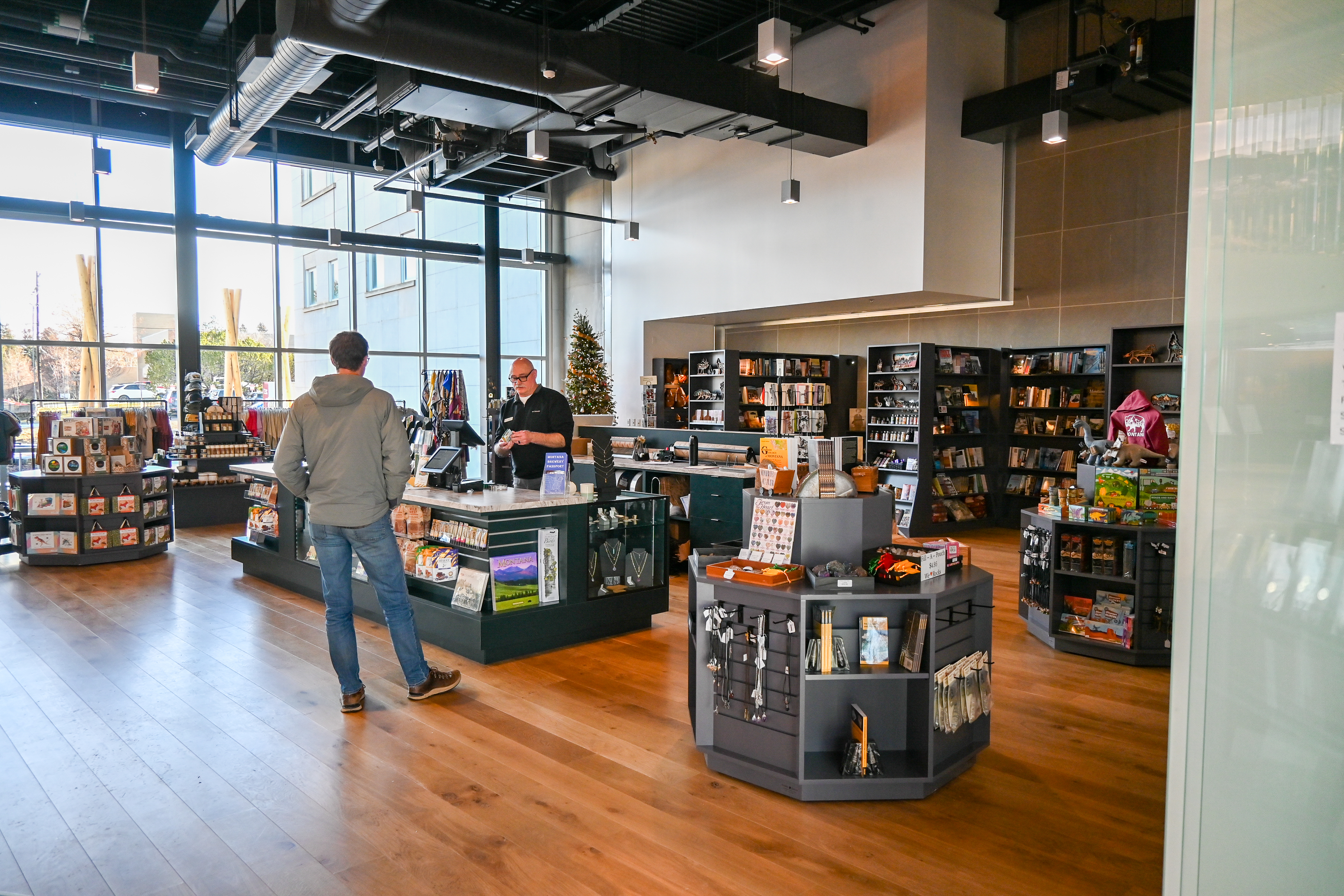 A customer browsing the selection of books at The Gift Shop.
