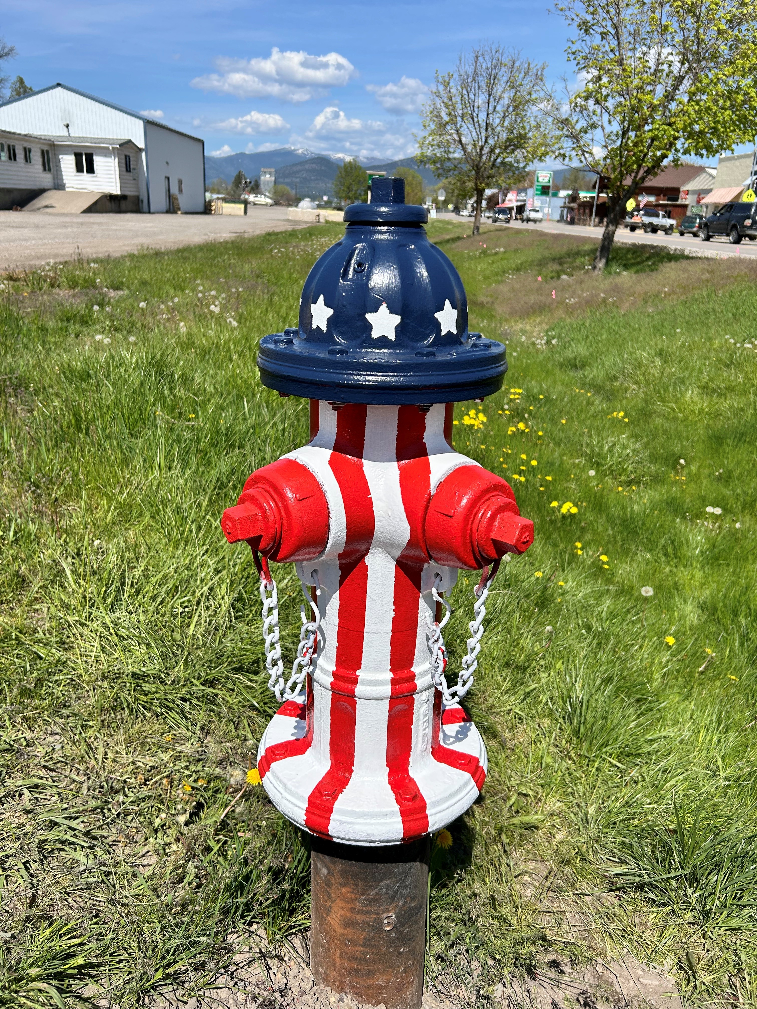 Fire hydrant in Plains, Montana, painted in the colors of the American flag.